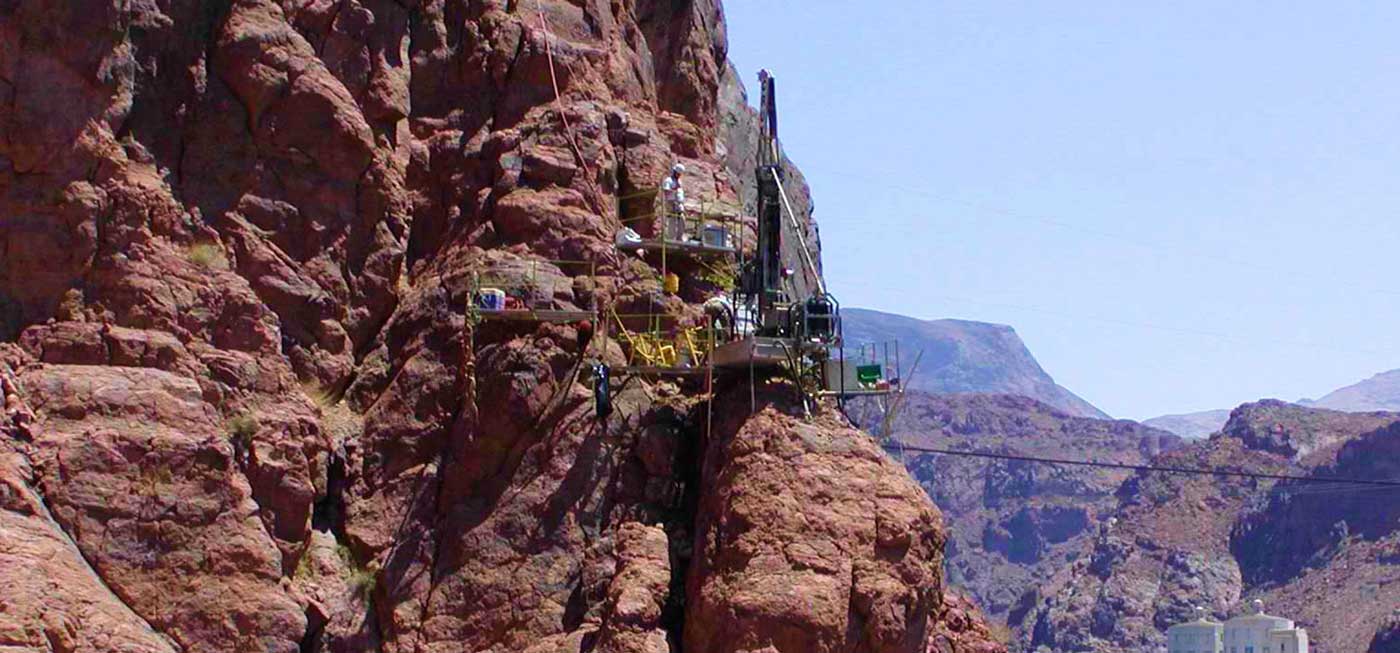 Crux Subsurface team working on a cliffside