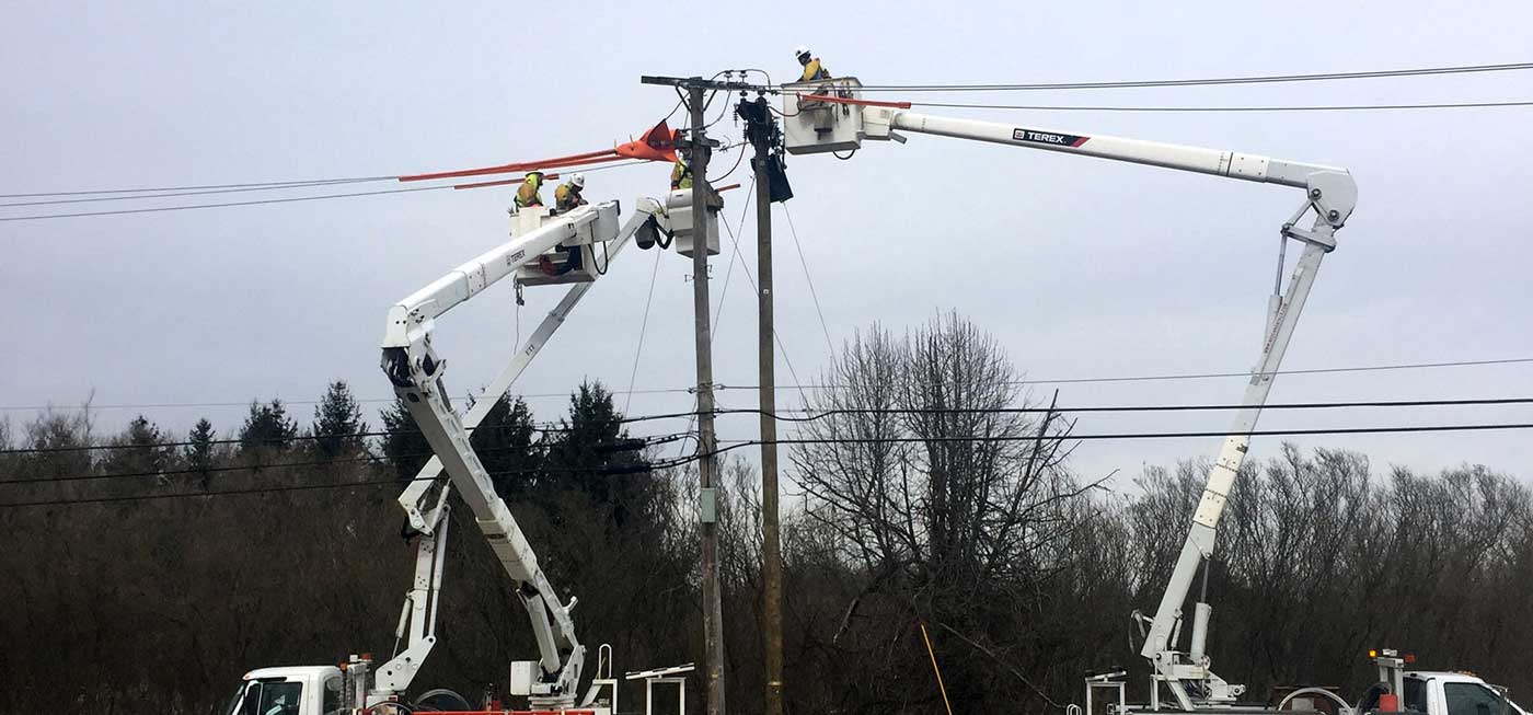 Robert Henry teams tend to electrical repairs in the field using mobile forms on their phones and tablets to collect critical project data